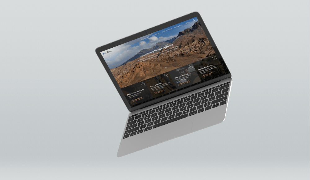 A floating laptop showing the Codan website