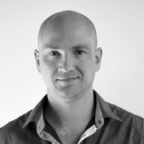 Black and white photo of Ashton Bishop smiling