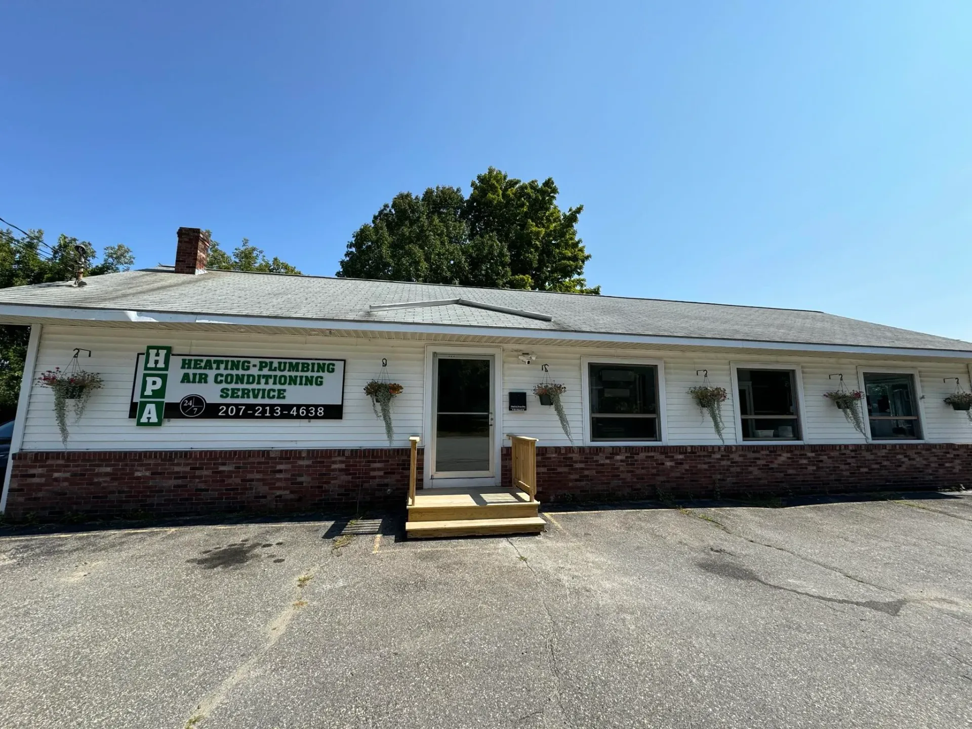 A white house with a green sign that says ' epd ' on it