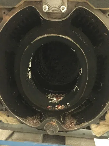 A close up of a hole in a metal object