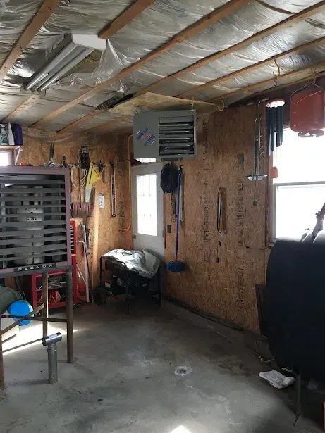 A garage with a lot of tools on the wall