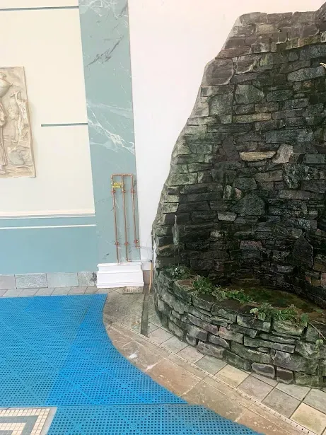 There is a waterfall in the middle of the room.