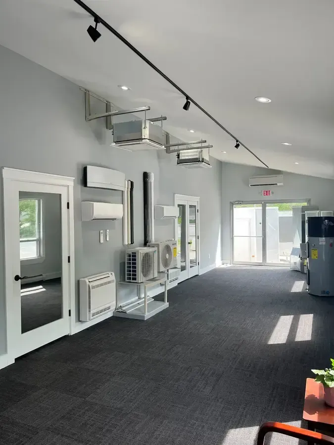 A white van is parked in front of a house.