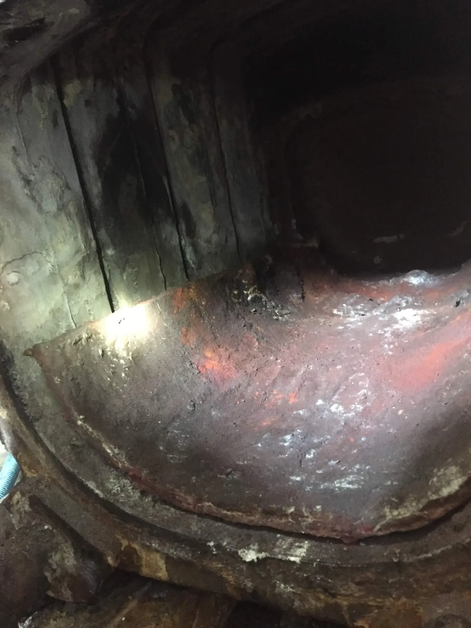 A close up of a metal object with a light shining through it.