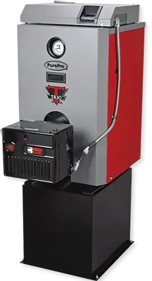 A red and gray boiler is sitting on top of a black box.