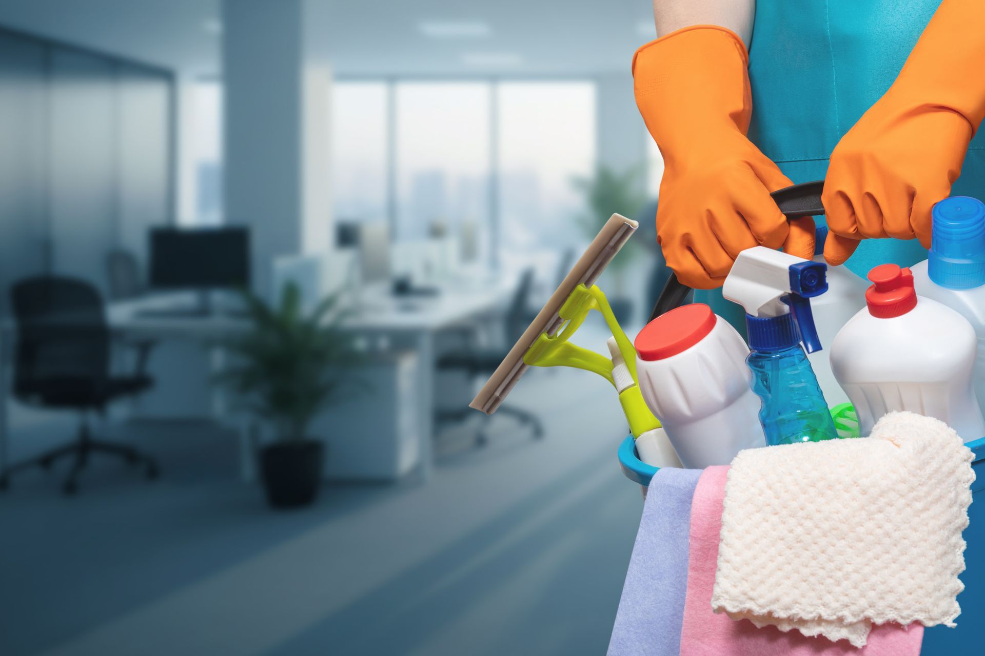 A bucket of gloves, sprays, and cloths is ready for thorough office cleaning services.