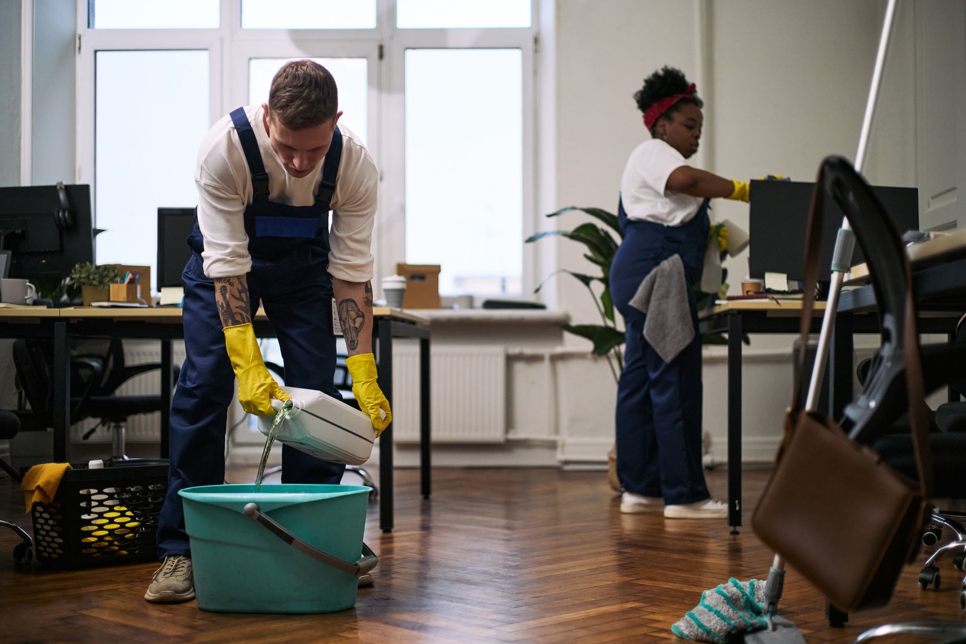 Office cleaning solutions with janitorial staff maintaining workspace cleanliness