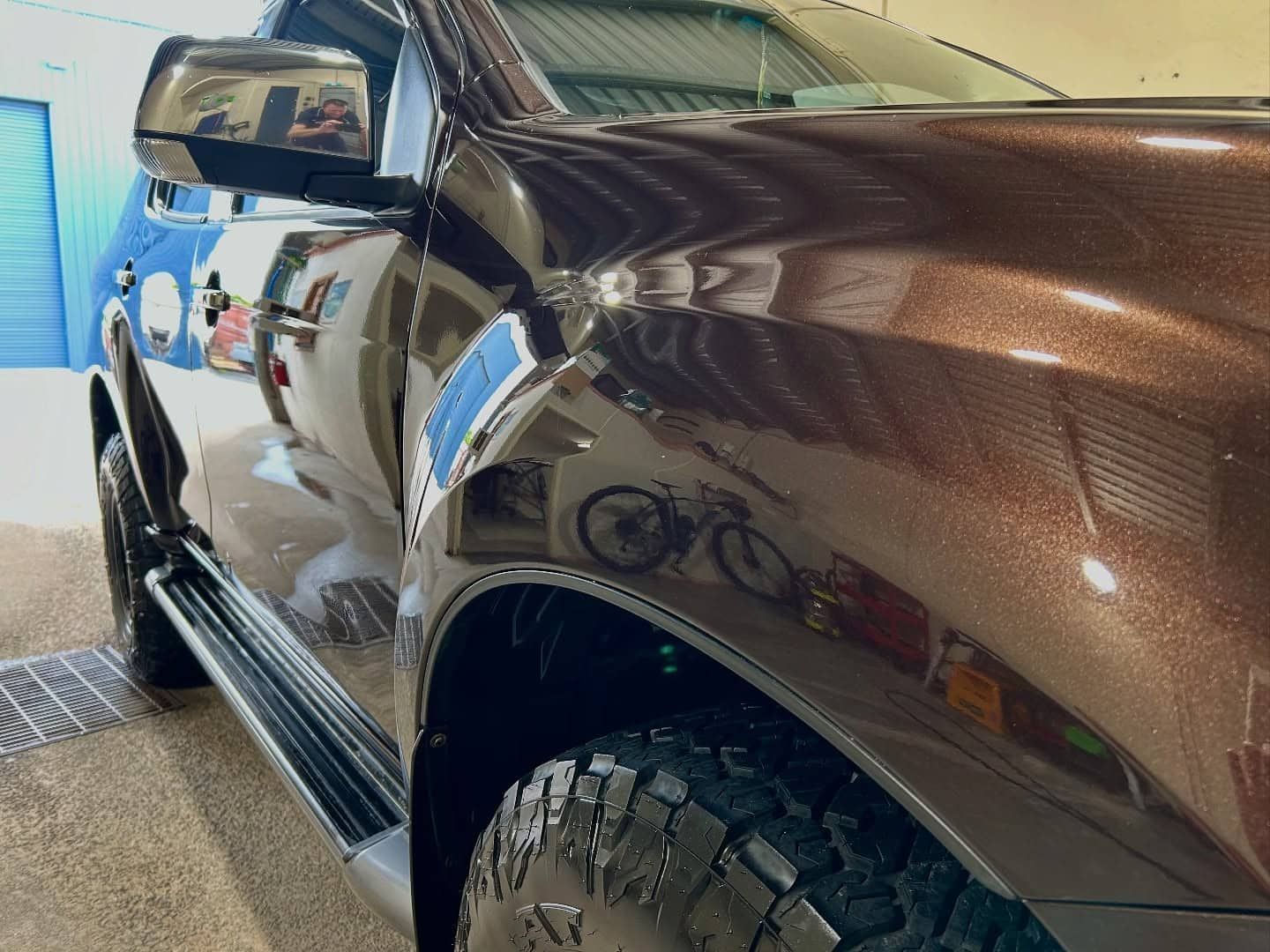 A Brown Pickup Truck Is Parked In A Garage — Fraser Coast Automotive Coatings in Dundowran, QLD