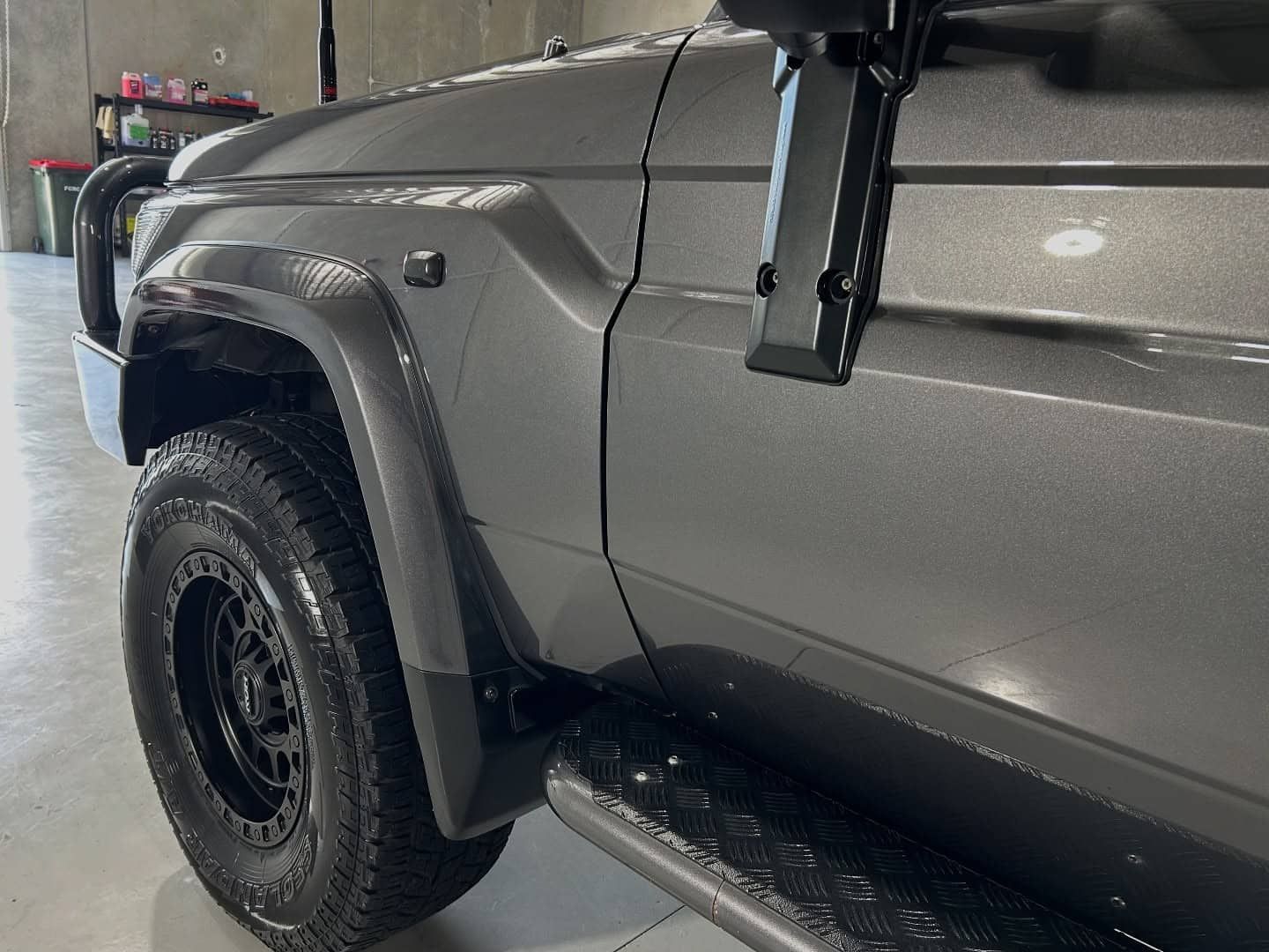 A Gray Truck With Black Tires Is Parked In A Garage — Fraser Coast Automotive Coatings in Dundowran, QLD
