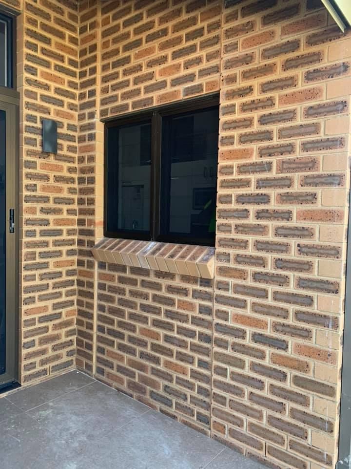 A Brick Wall With A Window In The Middle Of It — Eastcoast Aluminium & Glass In Ballina, NSW