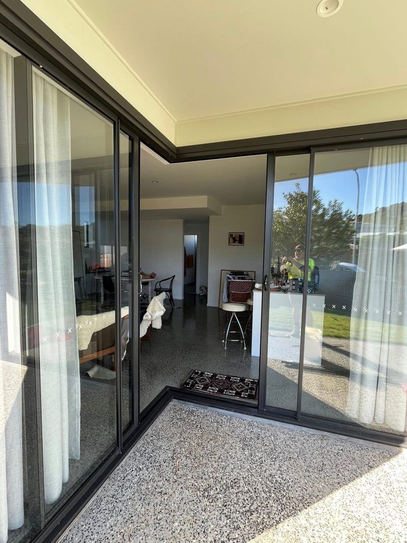 View From a Patio Into a Home, Sliding Glass Doors Frame the Interior — Eastcoast Aluminium & Glass In Ballina, NSW