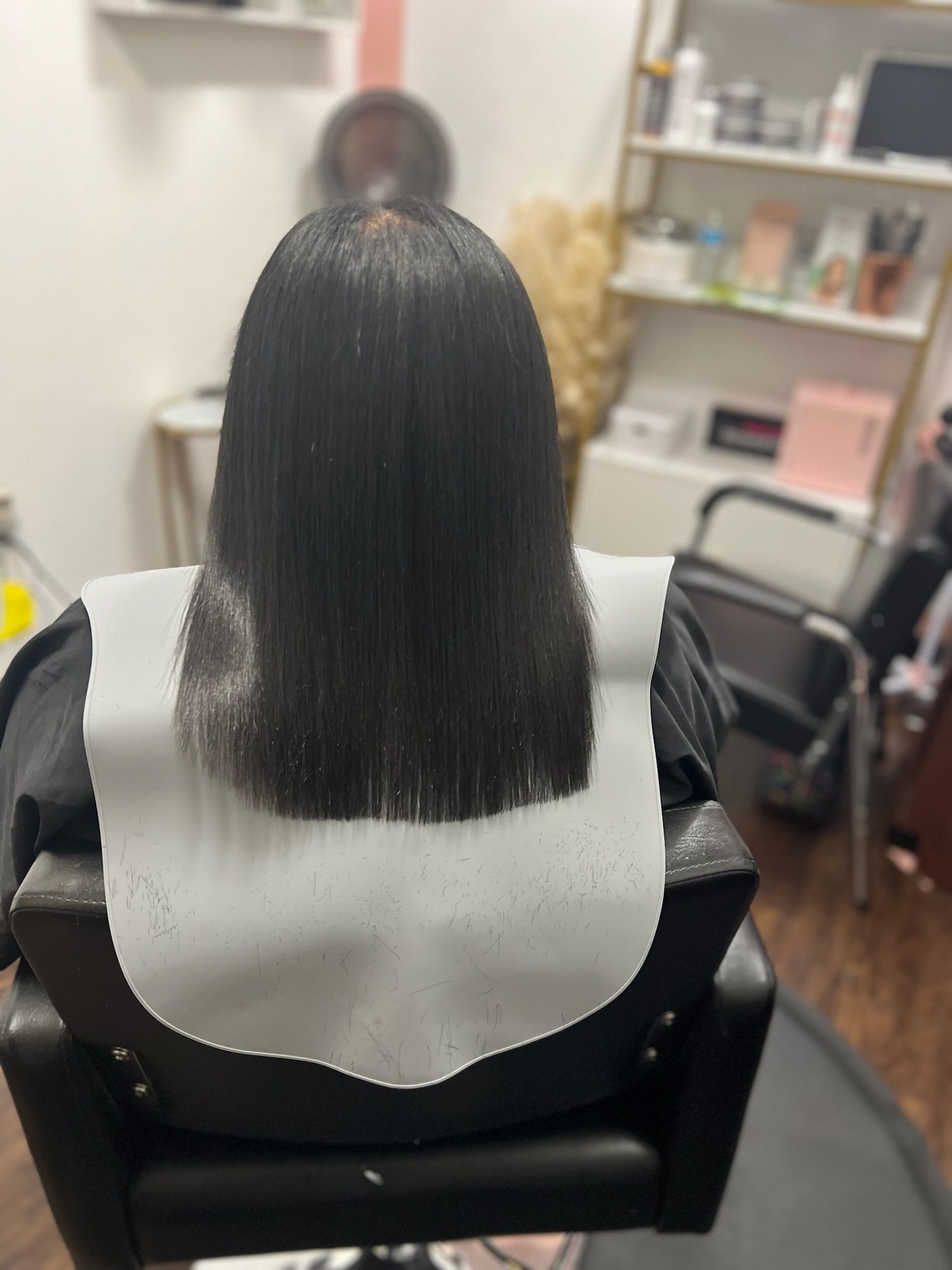 a lady with black freshly cut hair