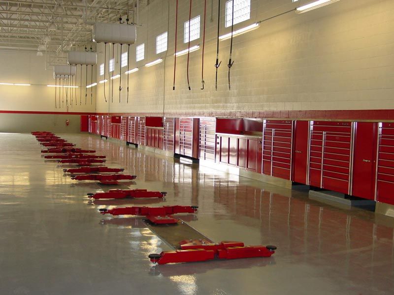 Red Car Lifts and Garage Cabinets — North Hollywood, CA — Airdraulics Inc.
