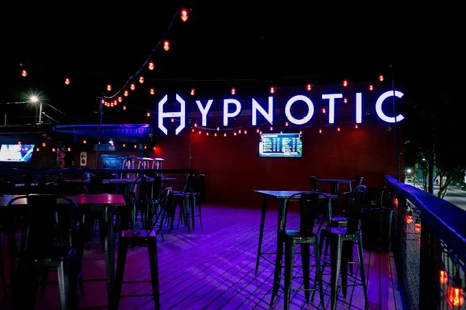Outdoor nighttime scene at a bar called