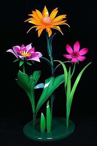 A bunch of flowers are sitting on top of each other on a black background.