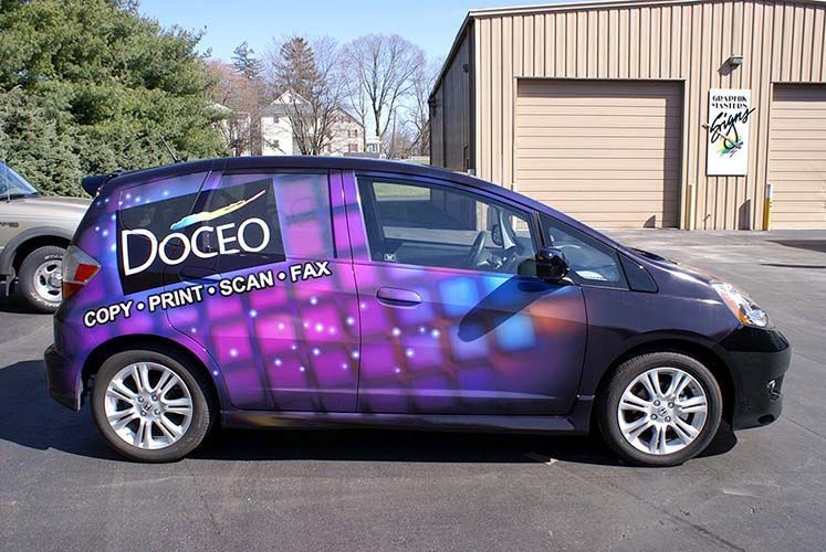 A purple car with the word doceo on it