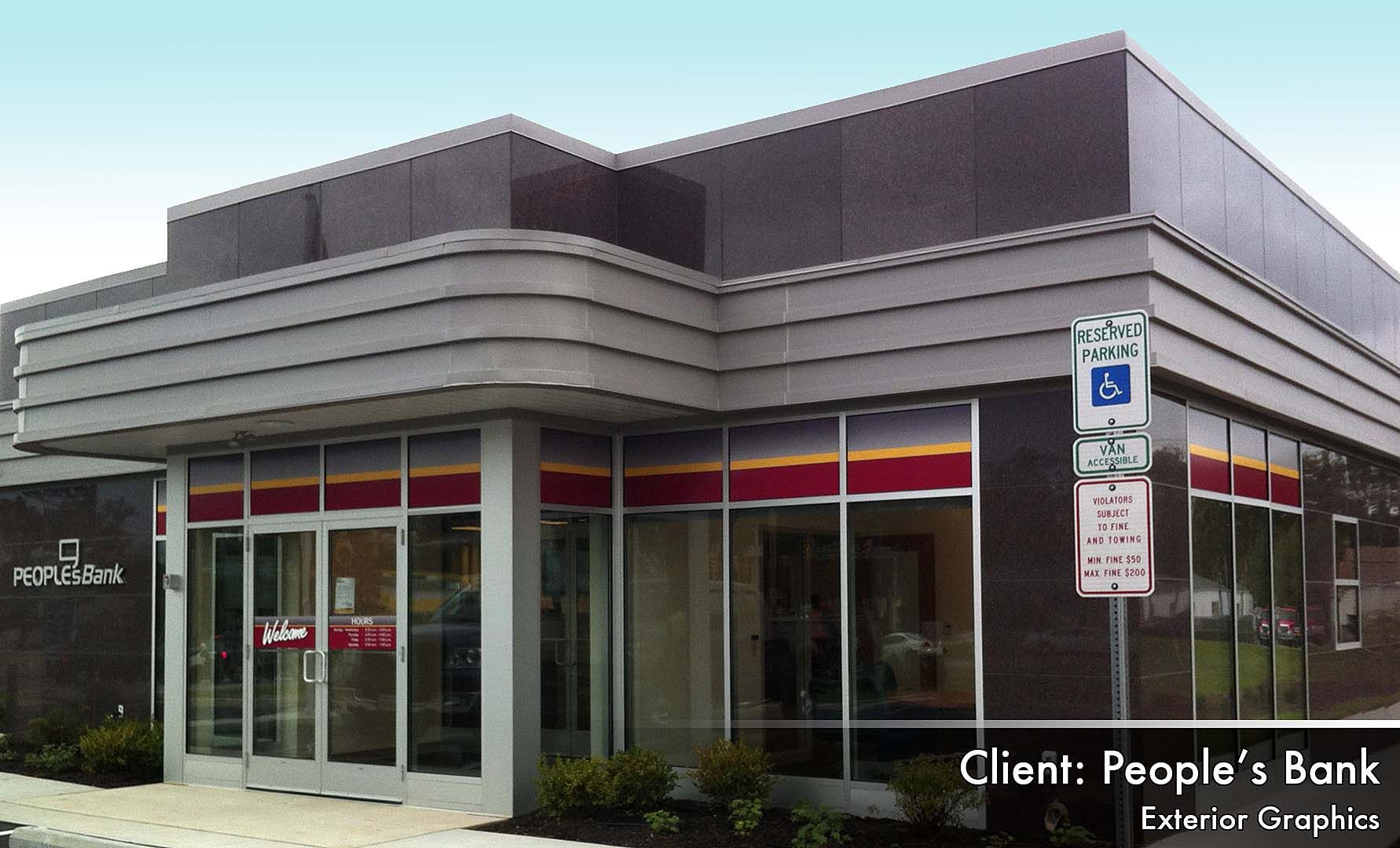 A people 's bank building with a handicapped parking sign