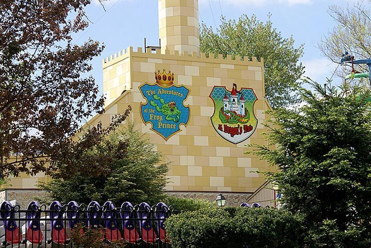A large brick building with a crest on it
