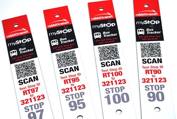 A row of mystop bus tracker tags with qr codes on them