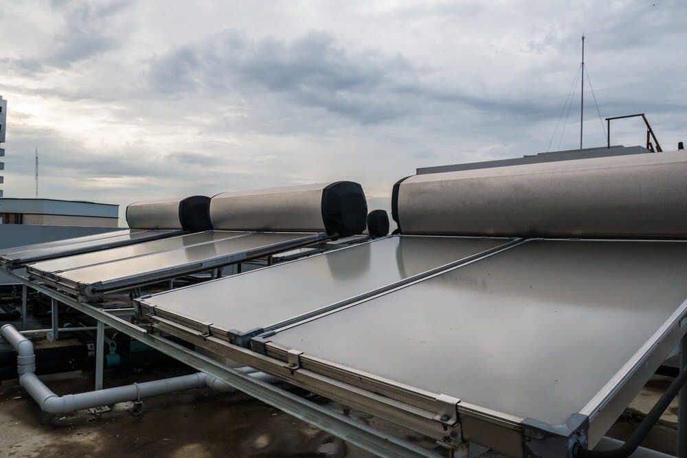 A Row of Solar Panels on The Roof of A Building — 24/7 HOT H2O in Nambour, QLD