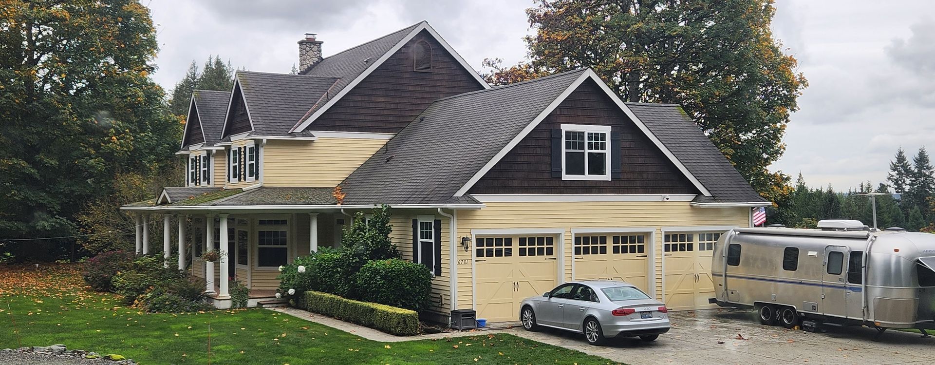 A large house with a car parked in front of it