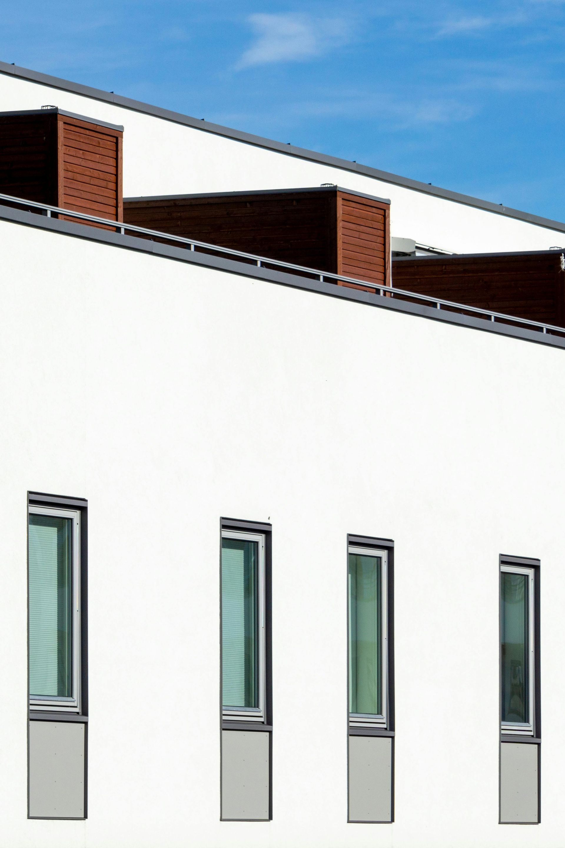 A white building with a blue sky in the background