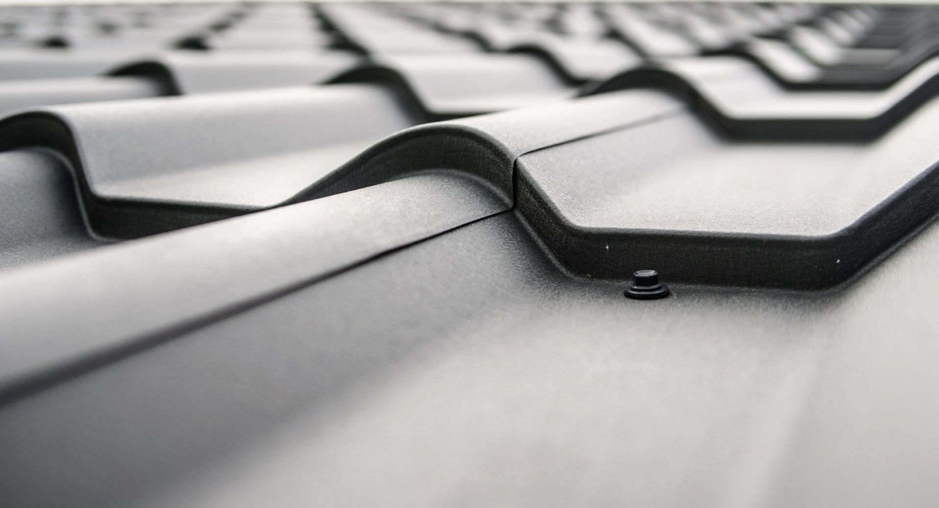 A close up of a metal roof with a white background