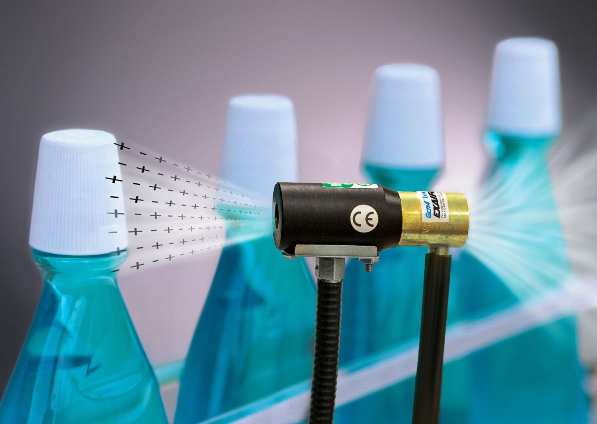 An Exair Static Eliminator removing static from plastic bottles