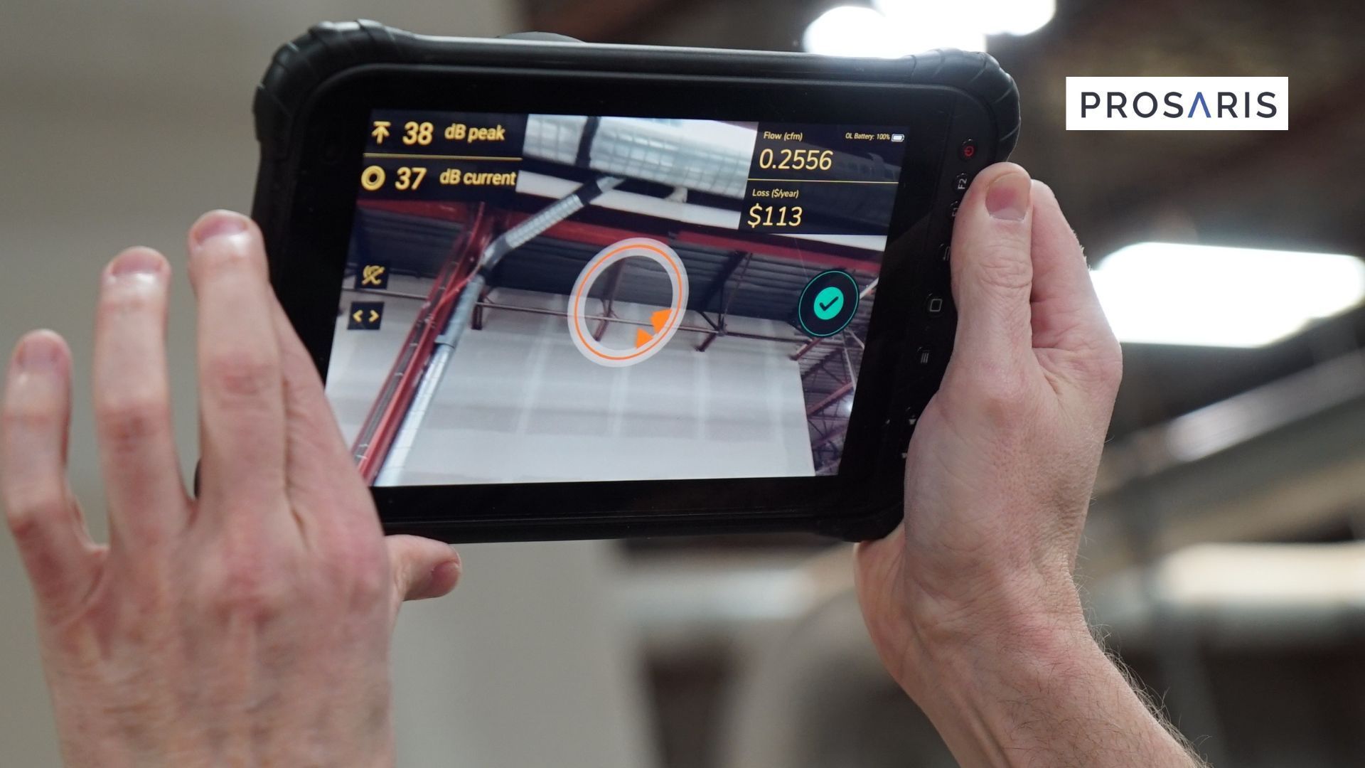 Worker holding an ultrasonic leak detector