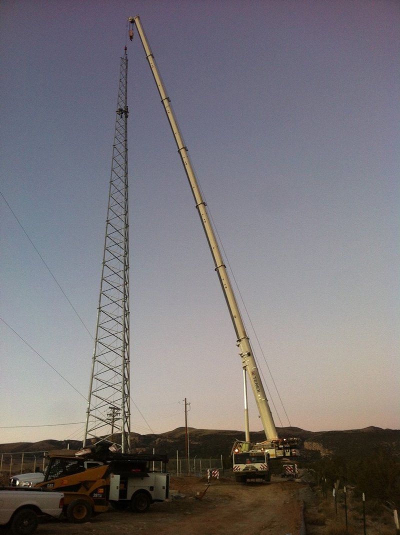 Crane Lifting Metal on Tower — Vernal, UT — J&C Enterprises Inc.