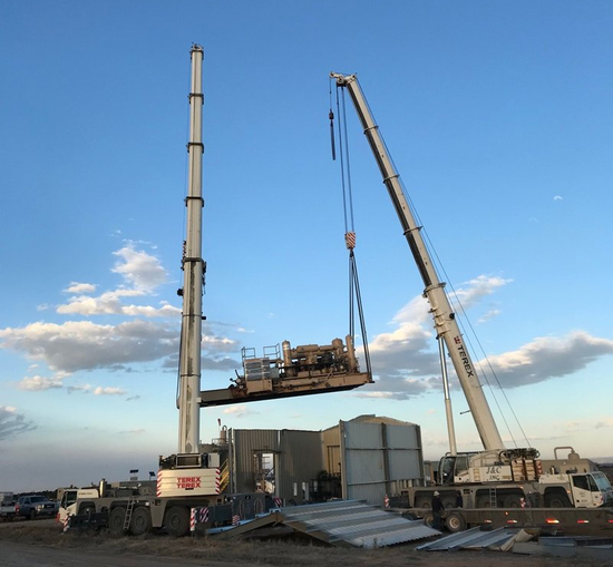 Worker with Helmet Operating a Crane — Vernal, UT — J&C Enterprises Inc.