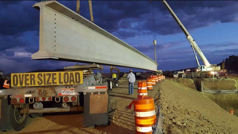Mobile Crane Lifting a Concrete Bar— Vernal, UT — J&C Enterprises Inc.