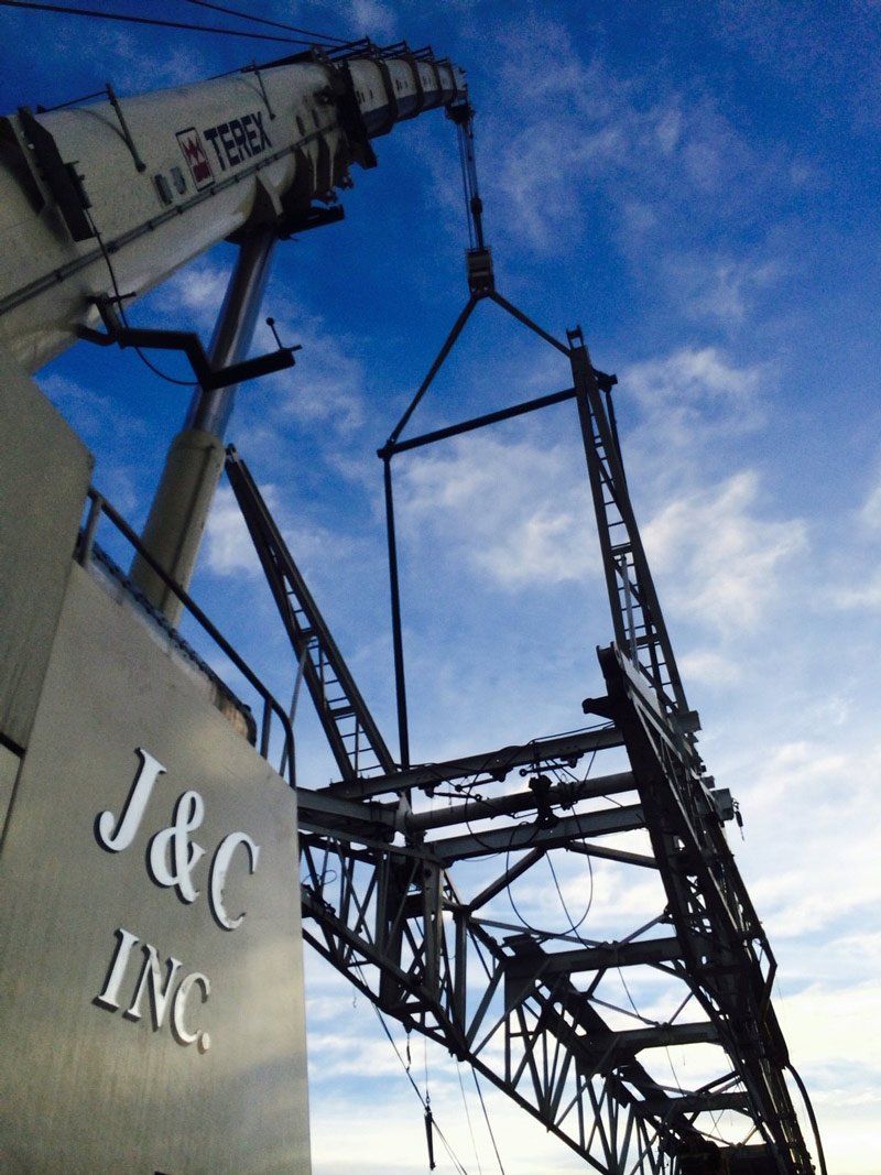 Mobile Crane Lifting a Metal Frame— Vernal, UT — J&C Enterprises Inc.