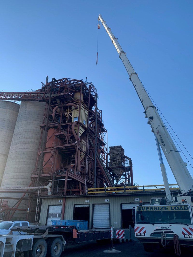 Crane Lifting a Metal on An Industrial Site — Vernal, UT — J&C Enterprises Inc.