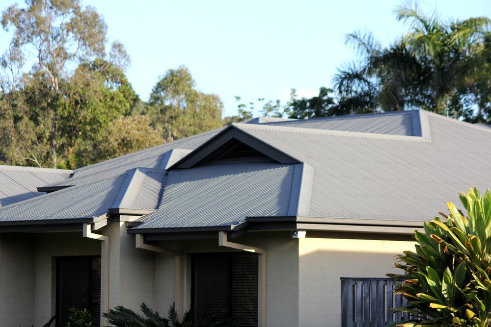 Metal Tile Roof With Rain Gutter — Plumbers in Harlaxton, QLD