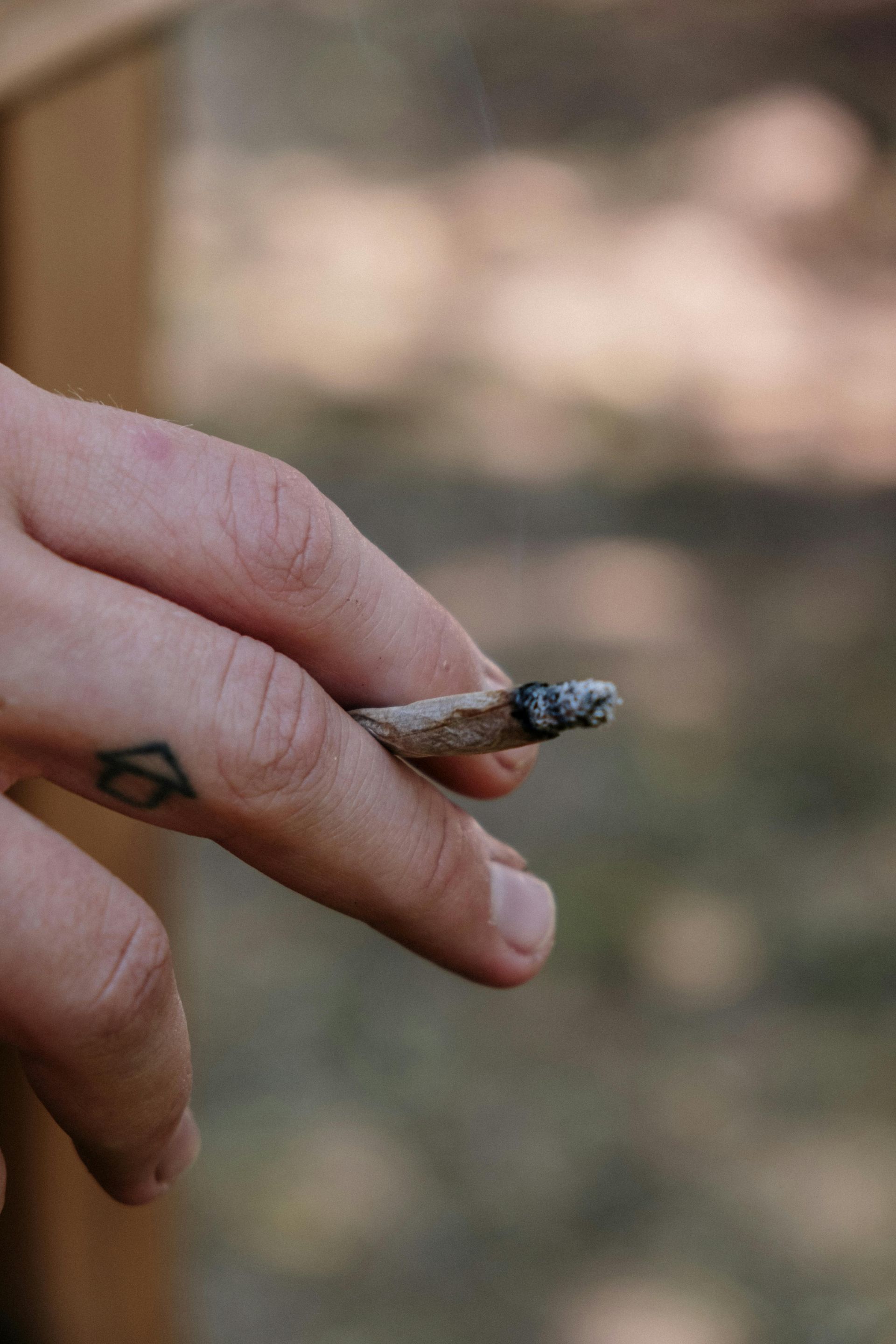 Smoker's hand guarding a clops