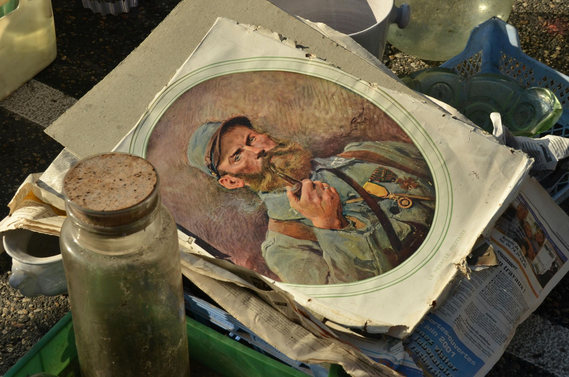 A vintage illustration of a sleeping soldier with a long beard, lying amidst clutter on a table.