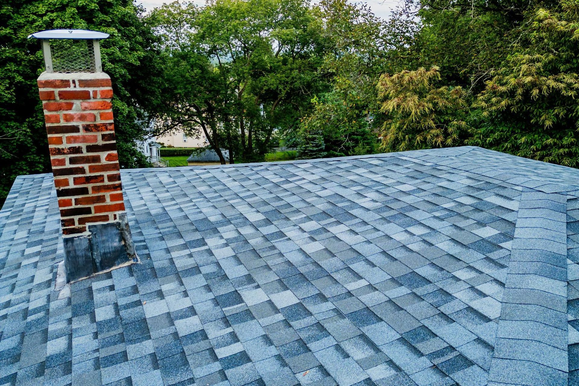 flat asphalt roof with chimney 