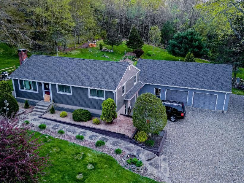 garage with a new asphalt shingle roof
