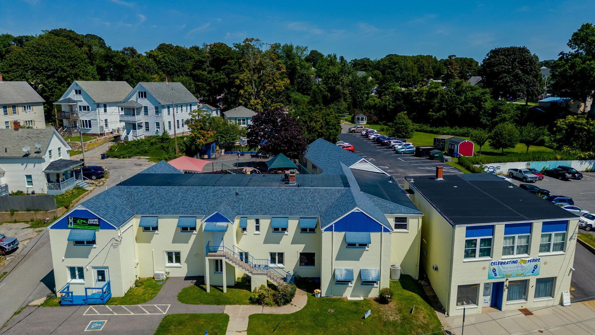 An aerial view of a building with a blue roof