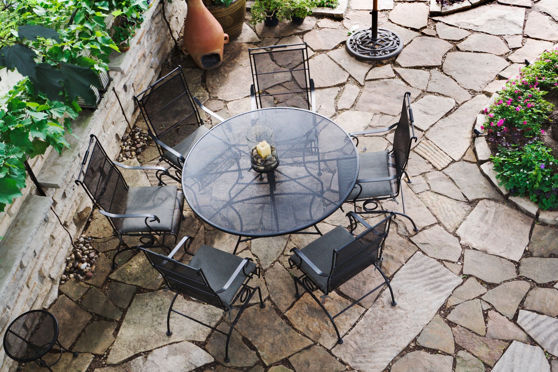 An aerial view of a patio with a table and chairs.