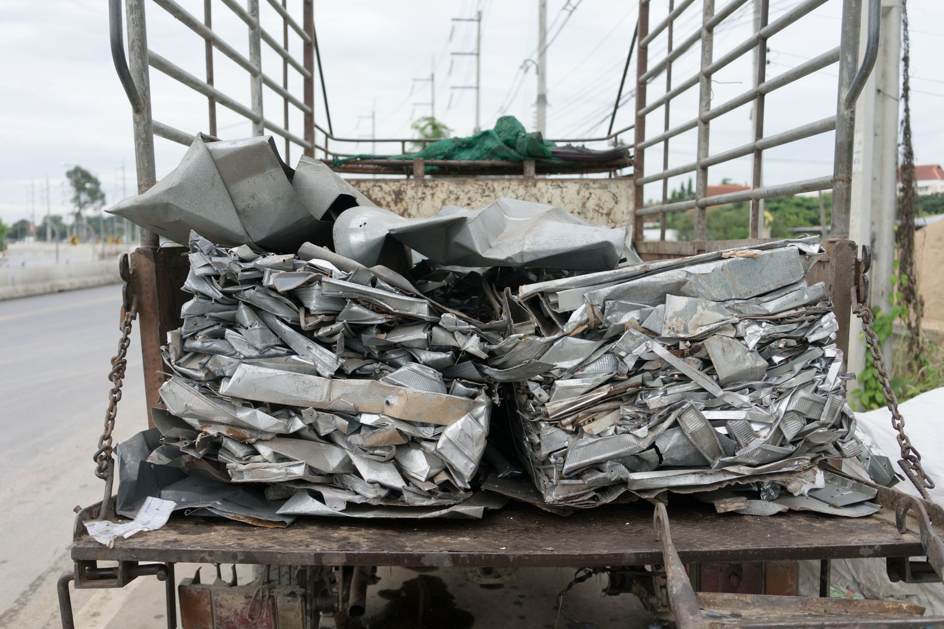 A truck is carrying a pile of scrap metal.