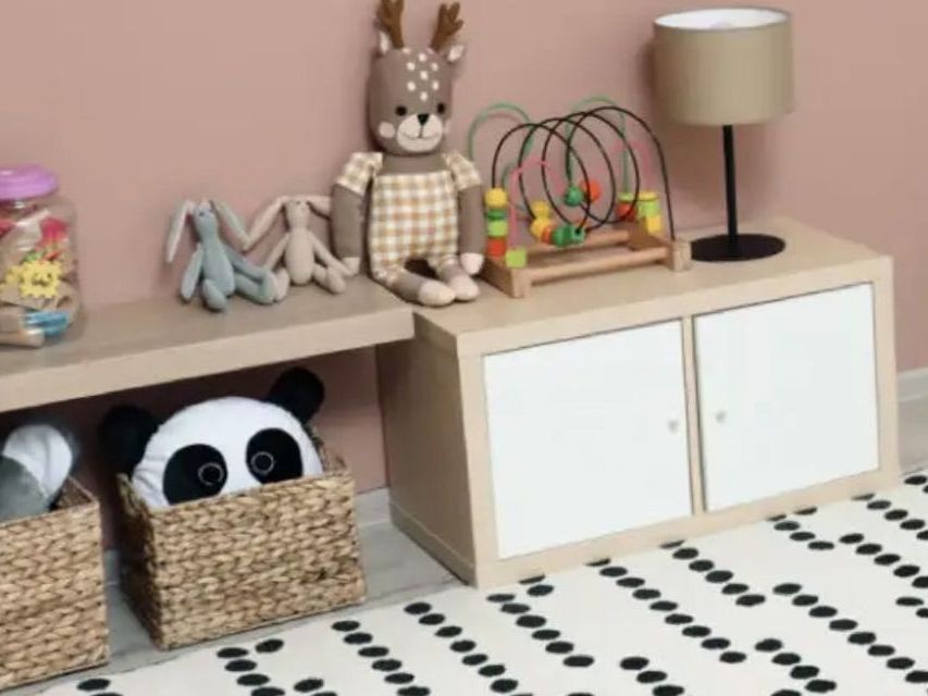 image of a low shelf and cabinet with a few toys and activities on them
