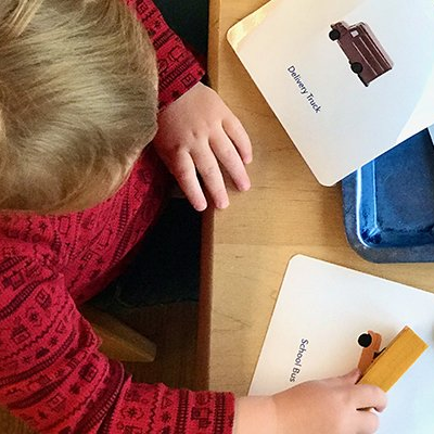 toddler with language cards