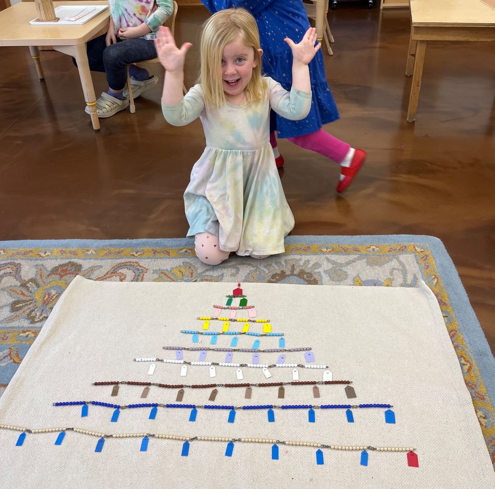 Smiiling child with units blocks