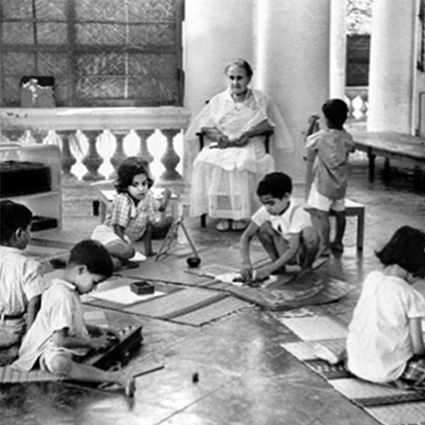 Black and white image of students with lessons on mats