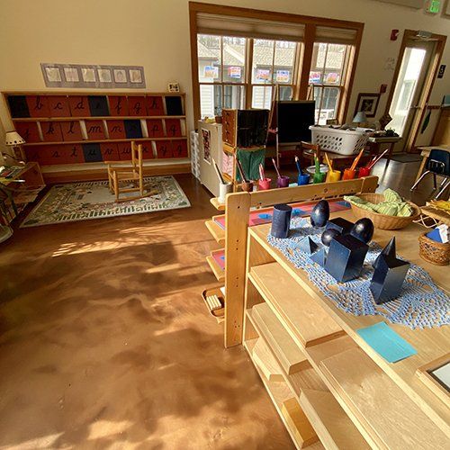 Shelf with wooden forms in classroom