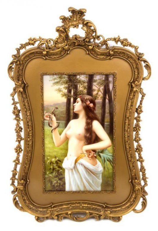 A picture of a woman in a gold frame