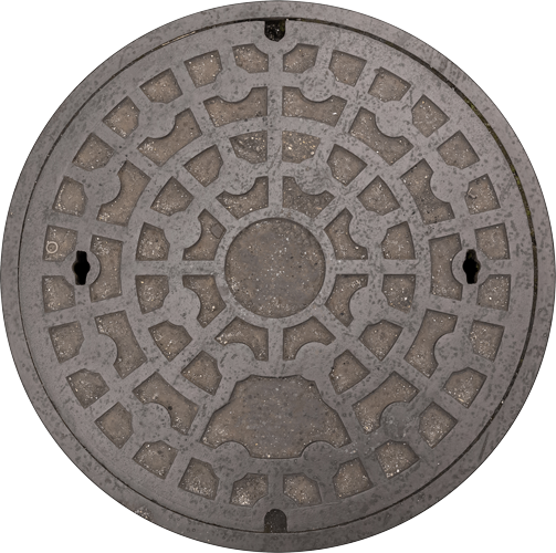 A manhole cover with a circular pattern on it