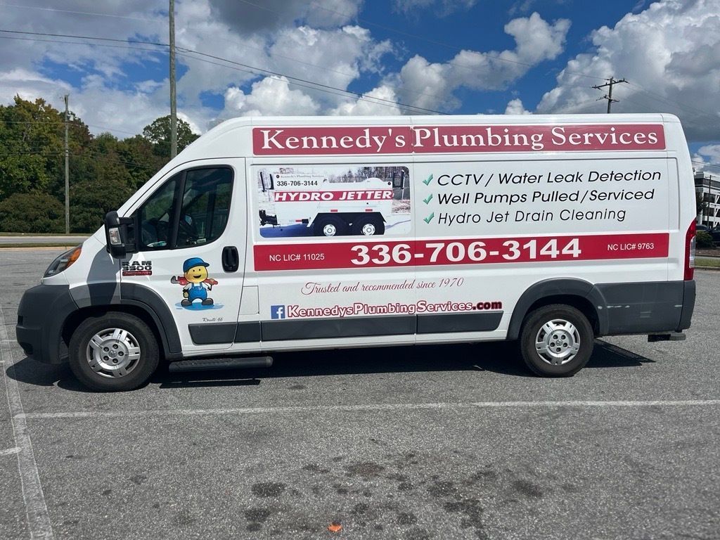 A white van in a parking lot.